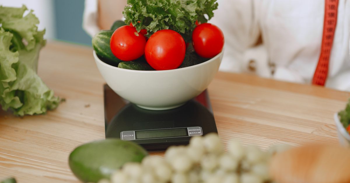Food scale measuring portions in a kitchen
