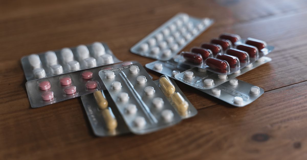 Blister strips of tablets on a wooden table, the regulated drugs that kitchen metabolism boosters are not