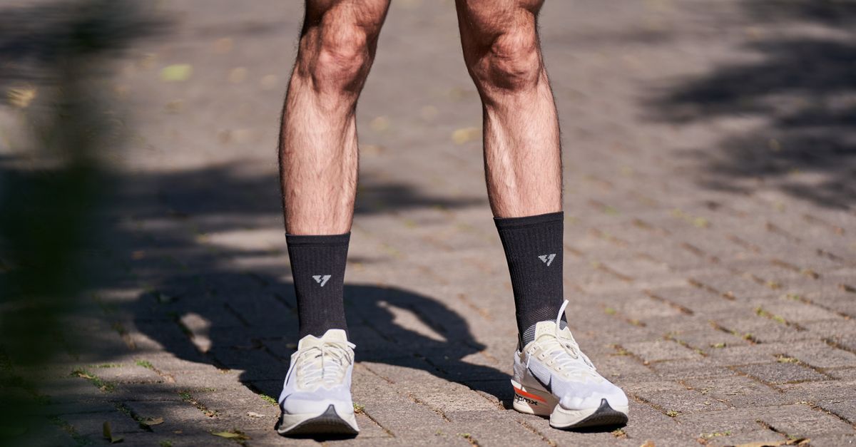 Close up of calves and lower legs in trainers