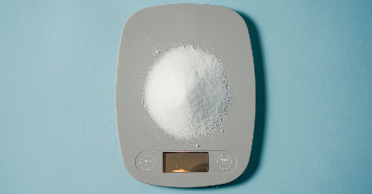 Digital kitchen scale weighing an ingredient, the measuring side of losing 20 lbs