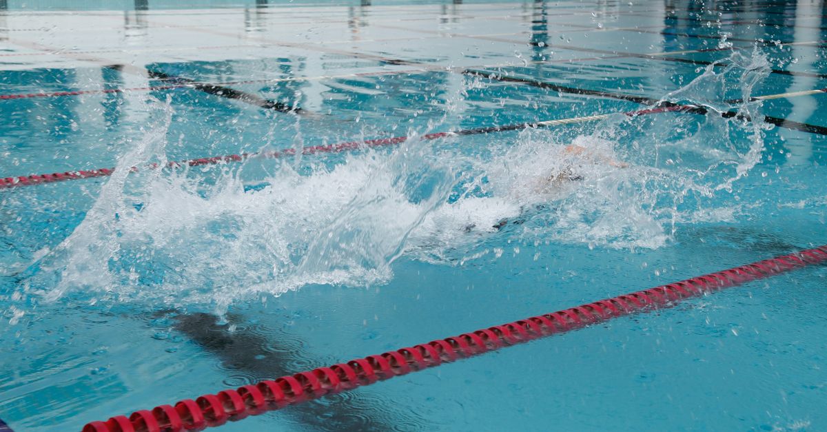 Churned white water thrown up across a swimming pool lane, the drag pool exercises work against