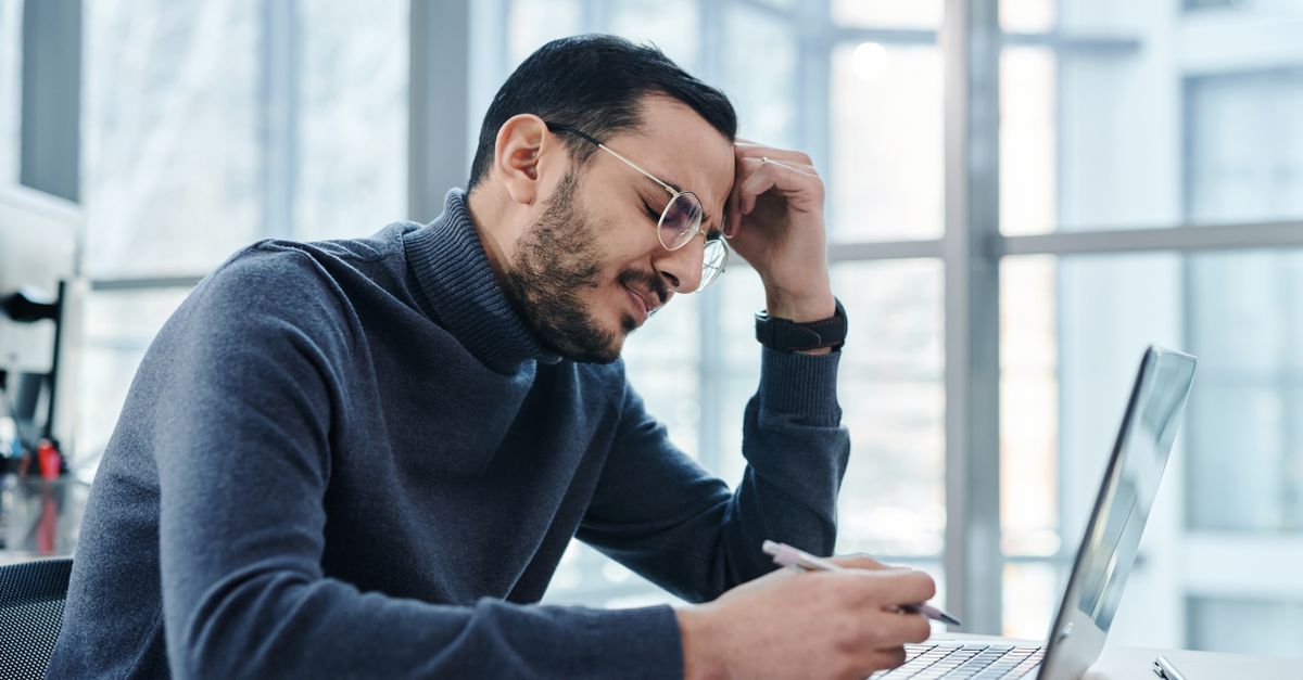 Man sitting at a laptop all day, inactivity linked to visceral fat even at a normal weight